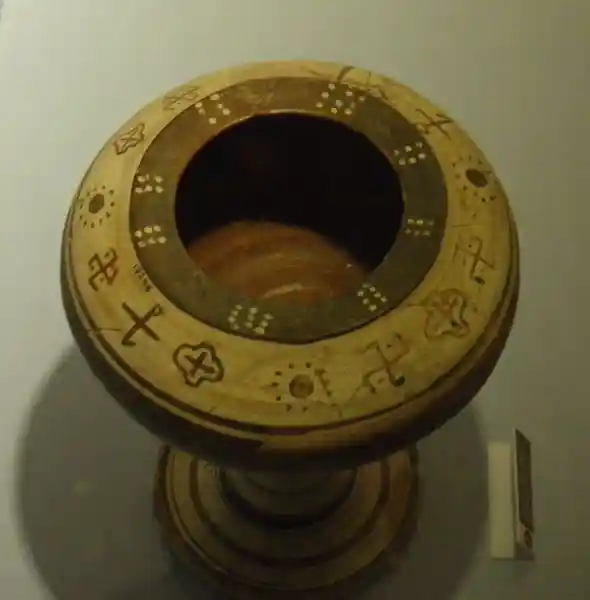 Solar symbols, crosses and sun rays on the mouth of a vase, located at Archaeological Museum of Izmir, Turkey.
